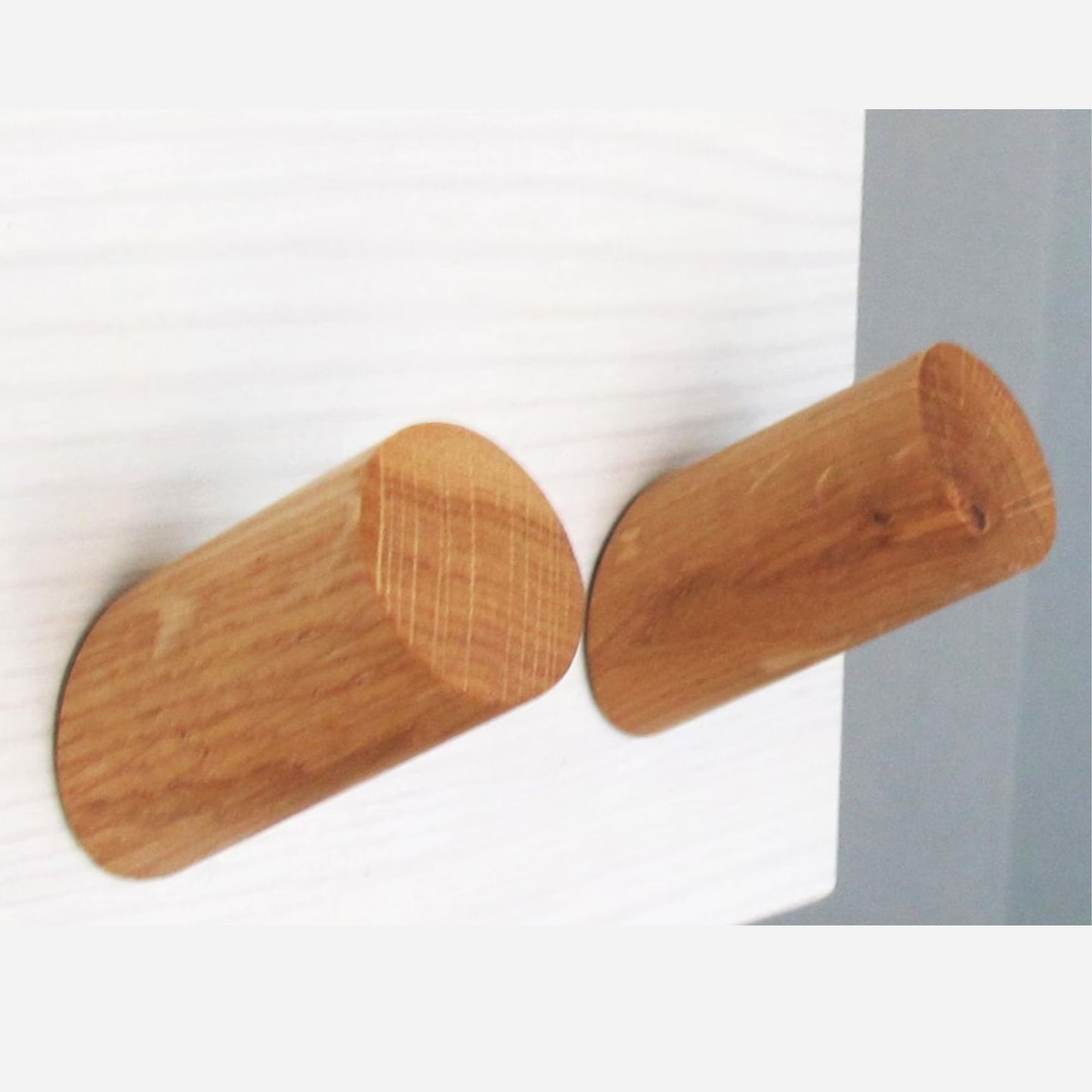 Handcrafted solid oak wall hooks with a modern angled design