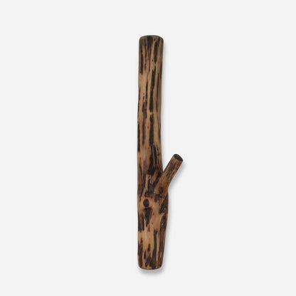 A lone oak wood wall hook with a natural, burnt appearance, shaped like a small tree branch, set against a white background.